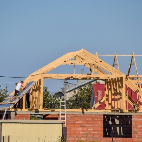 Timber roof frame under construction during a new custom home build