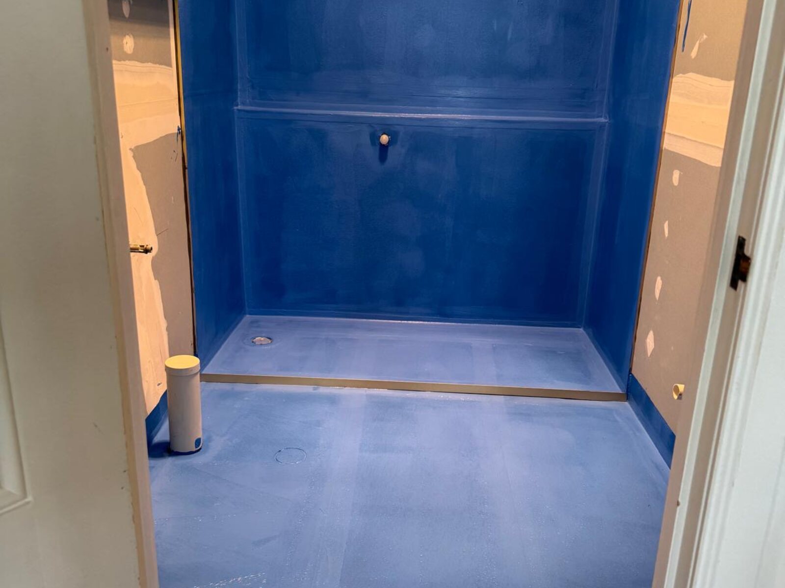 Certified waterproof membrane applied to shower base