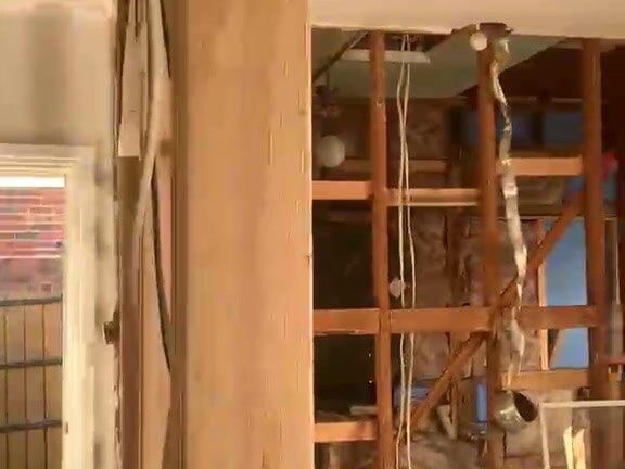 Acrow props providing structural support during wall removal